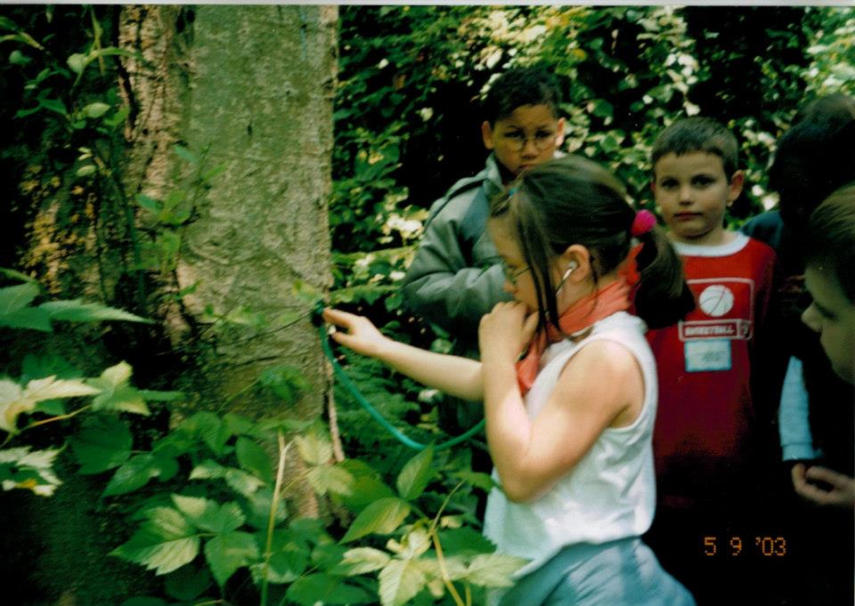 Kid-me listening to the heart beat of a tree